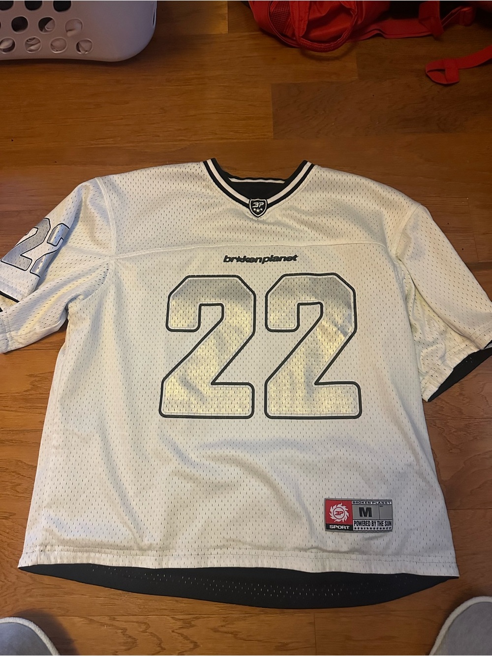 Black and white reversible broken planet jersey number 22
